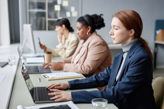 Female Company Employees Working on Computers in Office Women in Tech Working on Computers in Office