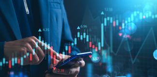 Nvidia Investing and stock market. A businessman checks financial data charts for trading forex, stocks, money, and digital assets. business finance, technology, and investment.