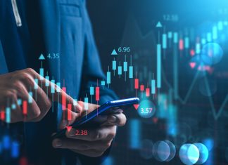 Nvidia Investing and stock market. A businessman checks financial data charts for trading forex, stocks, money, and digital assets. business finance, technology, and investment.
