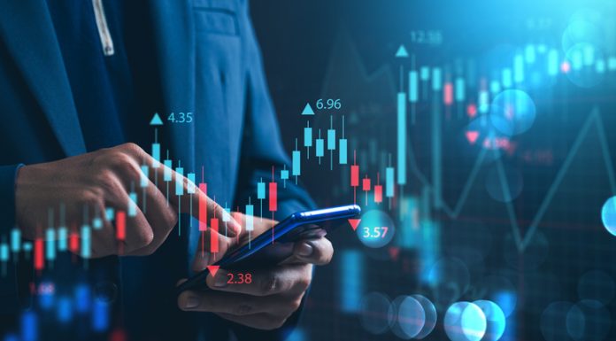 Nvidia Investing and stock market. A businessman checks financial data charts for trading forex, stocks, money, and digital assets. business finance, technology, and investment.
