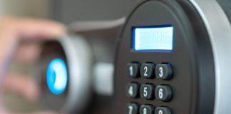 How Canadian Businesses Are Reinforcing Security with INKAS® Vault Doors and Safes Opening the safe box door.