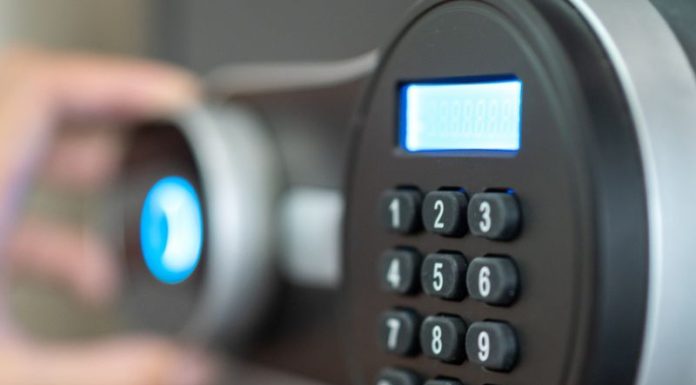 Opening the safe box door.