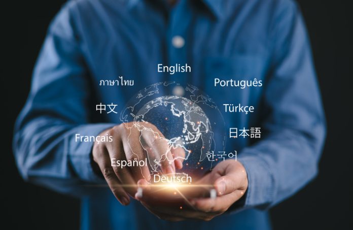 Translator app, language course and e-learning concept. Person use smartphone with Translator app, translation or translate on the mobile app worldwide language conversation speaking concept. Multilingual person