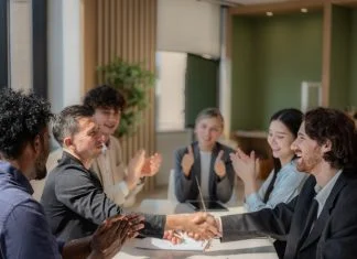 Business people shaking hands after negotiation