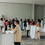 Diverse professionals networking and socializing at a business event