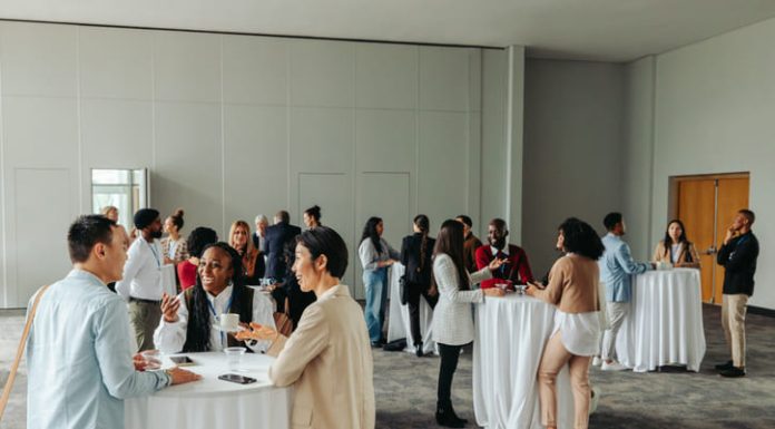 Diverse professionals networking and socializing at a business event