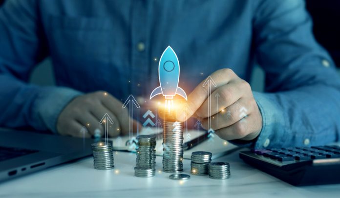 Startup business, idea, investment growth, success, goals,development,partnership,motivation,target, leadership concept. Businessman for success touching virtual rocket launch and up arrow graph. Startup company with AI unicorn