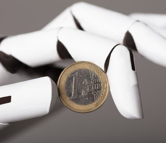 Avoiding the Janus Trap: Why Europe Must Commit to AI-powered Reinvention AI bot holding Euro coin. AI in Europe concept