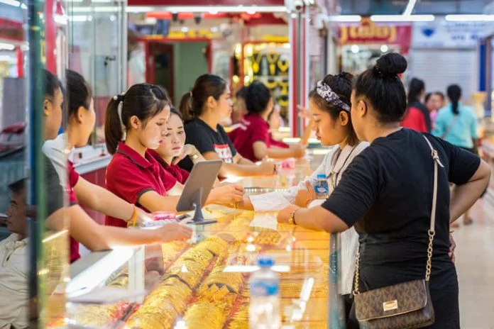 Young women buy gold