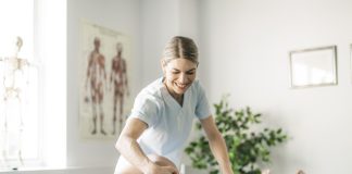 What You’re Missing If You Only See a Chiropractor for Chronic Pain Modern rehabilitation chiropractor worker with woman client for chronic pain