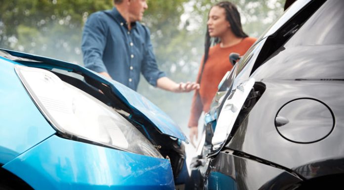 Two Angry Motorists Arguing Over Responsibility For Car Accident