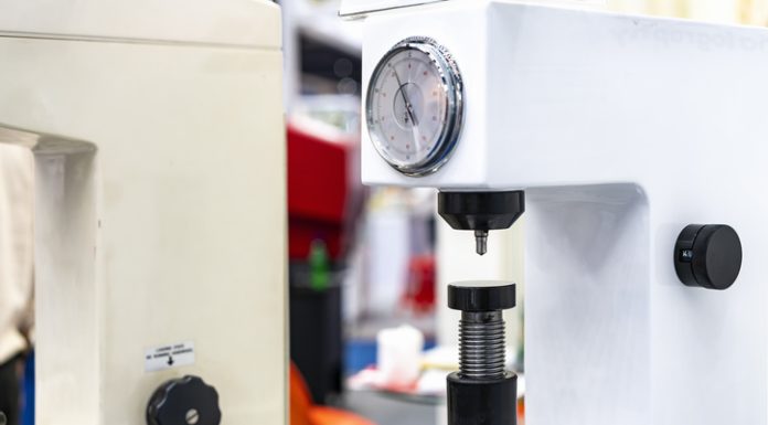 diamond head pin and adjustment move up down table of Rockwell hardness tester machine for inspection property hardness value of specimen sample material or product