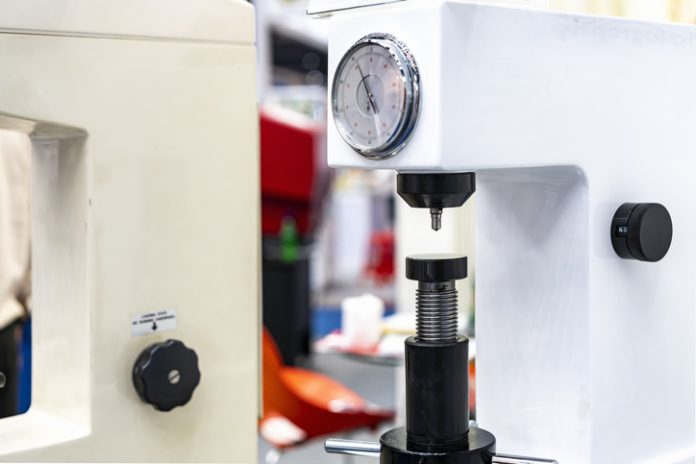 diamond head pin and adjustment move up down table of Rockwell hardness tester machine for inspection property hardness value of specimen sample material or product