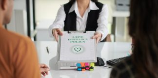 What is ULIP? A Beginner’s Guide for Freelancers and Entrepreneurs Agent giving life insurance policy to young couple after discussing ULIP