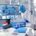 Doctor conducting experiment in laboratory with technology