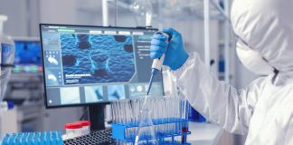 How to Drive Laboratory Efficiency and Traceability Through Digital Transformation Doctor conducting experiment in laboratory with technology