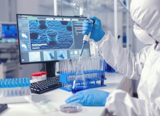 Doctor conducting experiment in laboratory with technology