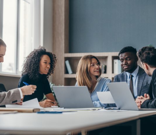Master’s in Management (mim) students studying in library