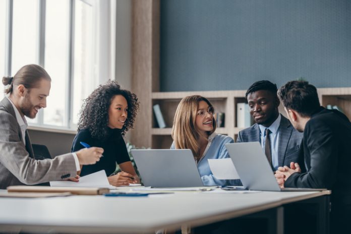 Confident group of business people discussing strategy during corporate meeting in the office Master’s in Management (mim) students studying in library