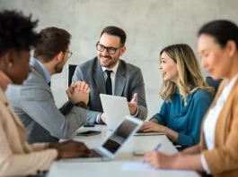 Businessman with emotional intelligence together with successful multiethnic business people working on teamwork meeting in corporate office.