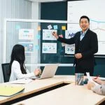 Chief marketing officer (CMO) having a presentation with the colleagues