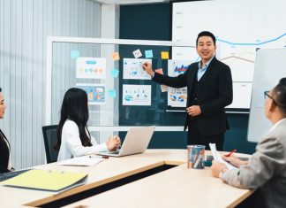 Chief marketing officer (CMO) having a presentation with the colleagues