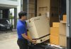 courier unloading a large box