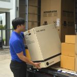The Smarter Way to Send Oversized Items with a Large Item Courier courier unloading a large box