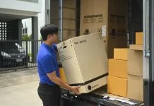 courier unloading a large box
