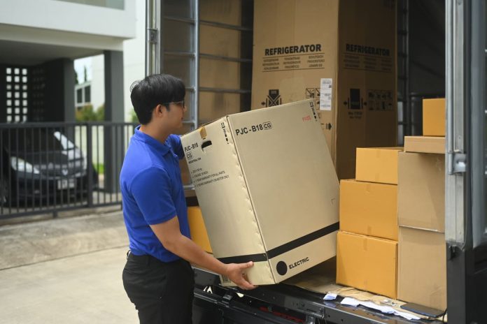 courier unloading a large box