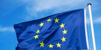 The Association of Related Churches Expands Its Reach Across Europe The flag of the EU European Union flutters in the wind. Churches in europe