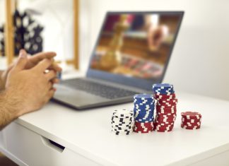 male gambler playing online roulette game and matadorbet.