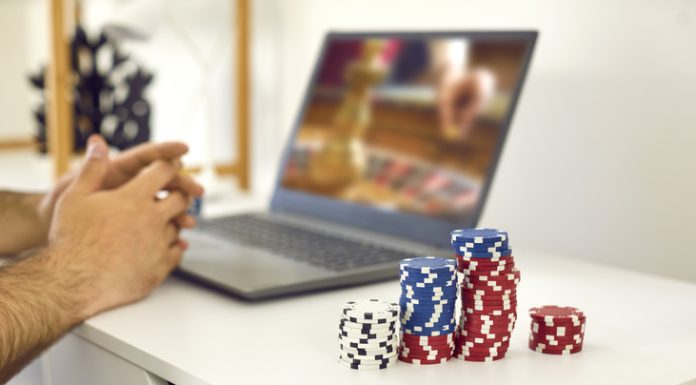 male gambler playing online roulette game and matadorbet.