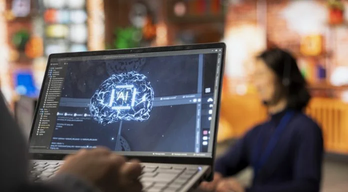 Call center worker using AI tech on laptop to reply to customers using AI in Website Builders