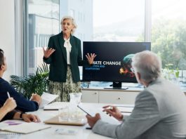 The Better Boards Podcast Series: Overcoming Misconceptions and Lies in the Boardroom Presentation, paperwork and board directors in office with team for AI governance system.