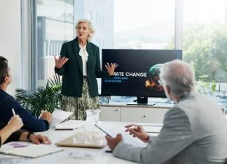 The Better Boards Podcast Series: Overcoming Misconceptions and Lies in the Boardroom Presentation, paperwork and board directors in office with team for AI governance system.