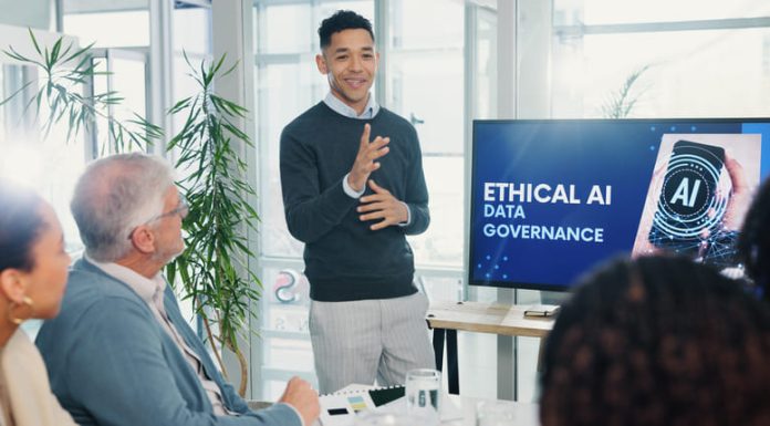 Man, presentation and screen with meeting for AI ethics, smile and planning for future web development at office. Person, speaker and staff in boardroom with data governance at startup tech agency