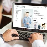 man personalized shopping online with a laptop, All screen graphics are made up.