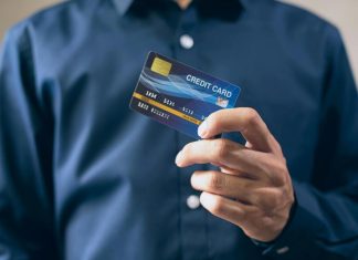 Person Holding a Credit Card
