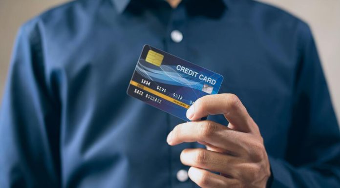 Person Holding a Credit Card