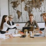 Why Hong Kong Company Registration Remains a Top Choice for Modern Startups Young entrepreneurs in a modern office discussing Hong Kong company registration & digital strategies for modern startups.