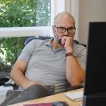 Corporate leader looking at the computer