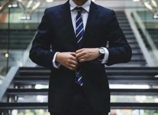 Businessman standing near the stairs. Healthy risk-taking in business