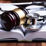 Doctors - Stethoscope And Mallet Over Opened Law Book