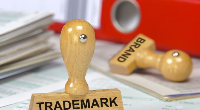 The Role of Trademark Registration in Building a Strong Startup Brand trademark printed on rubber stamp