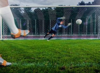Club - Anonymous Soccer Player Kicks Ball on Penalty