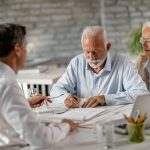 Senior couple discussing Living Wills and Advance Care Directives with a lwayer