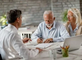 Understanding Living Wills and Advance Care Directives in Australia Senior couple discussing Living Wills and Advance Care Directives with a lwayer
