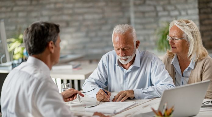 Understanding Living Wills and Advance Care Directives in Australia Senior couple discussing Living Wills and Advance Care Directives with a lwayer