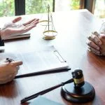 Attorney discussing legal case with client meeting